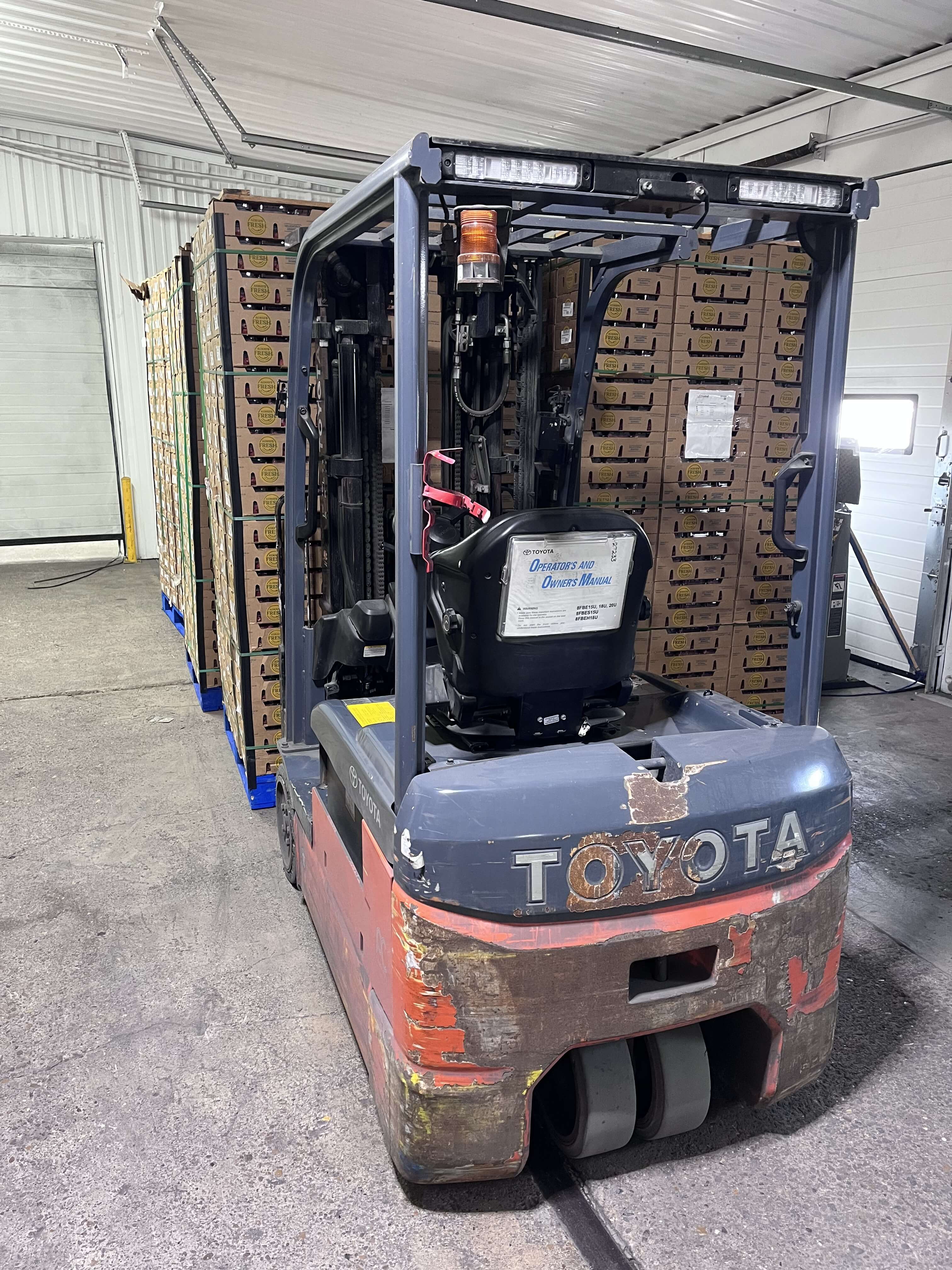 Toyota forklift handling produce pallets in the warehouse