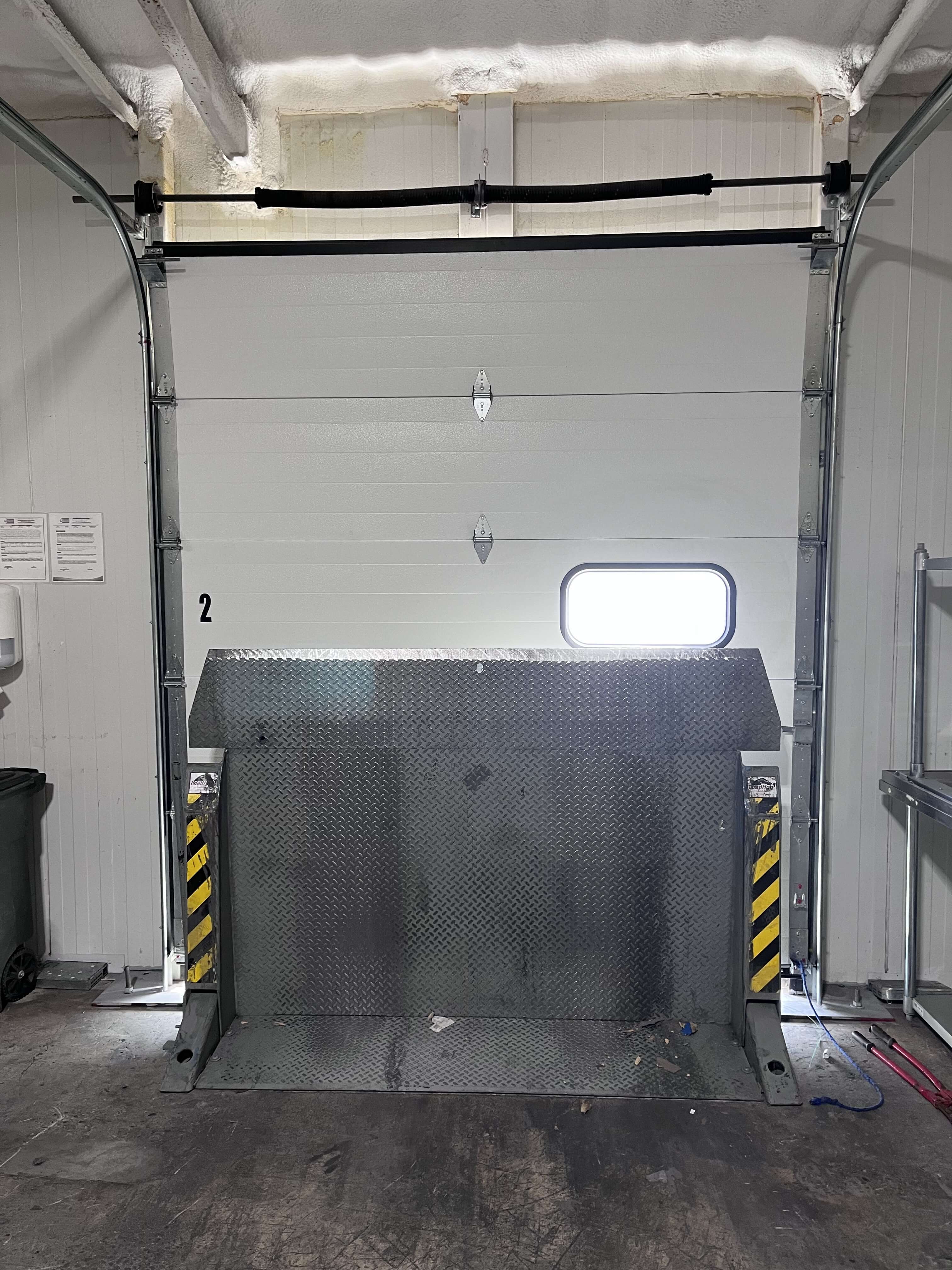 Loading dock door number 2 with dock leveler